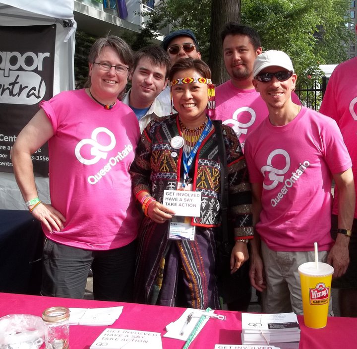 Native woman at Queer Ontario Pride Table